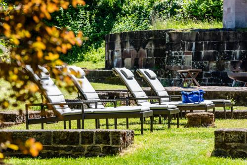 a group of chairs sitting in the grass at Kloster Hornbach in Hornbach