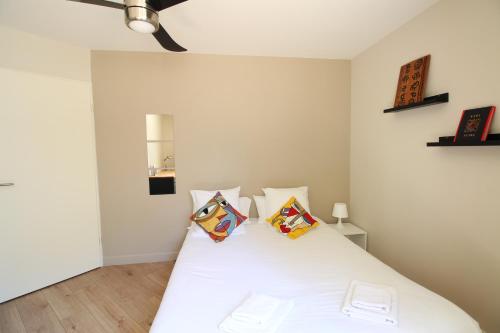 En eller flere senge i et værelse på Mon Appart A VILLON-MONPLAISIR