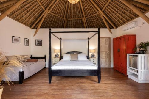 Postel nebo postele na pokoji v ubytování Amahelia Luxury Resort & Restaurant - Gili Asahan