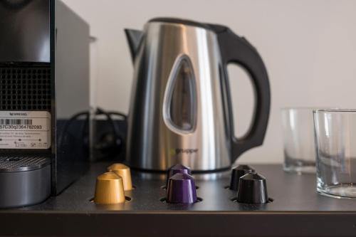 a coffee pot sitting on top of a counter at Hyperion City Hotel & Spa in Chania Town