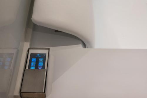 an elevator in an office building with an ipod machine at Hyperion City Hotel & Spa in Chania Town