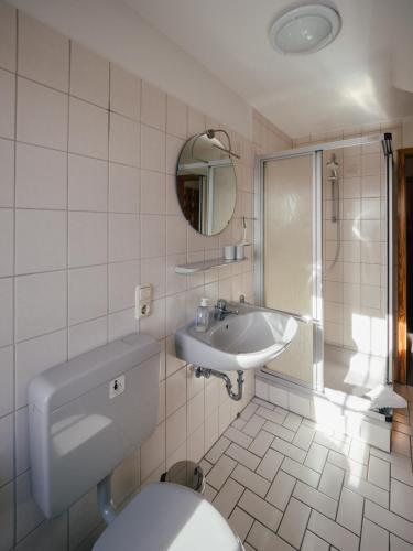 a bathroom with a toilet and a sink at Seaside 26 in Friedrichskoog