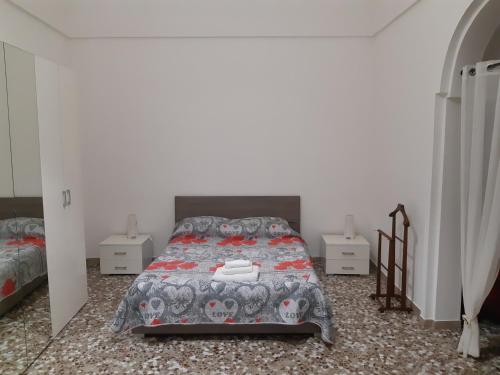 Łóżko lub łóżka w pokoju w obiekcie alloggio peroscia