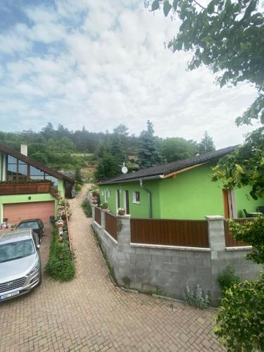 a car parked in front of a house at Penzion U Pavla in Most