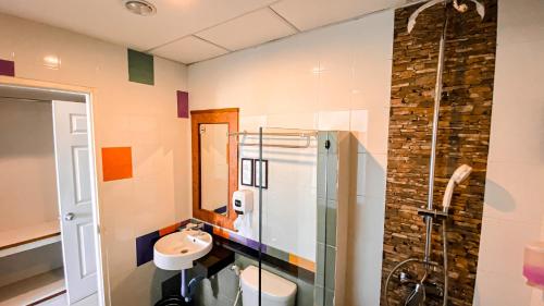 a bathroom with a sink and a shower at K2 Hotel at Thachang in Ban Pa Yang