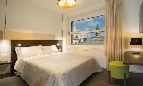 Postel nebo postele na pokoji v ubytování Enjoy Duomo - Flavio Baracchini 9