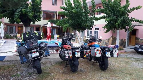 a group of motorcycles parked in front of a building at Hotel Pamukkale in Pamukkale