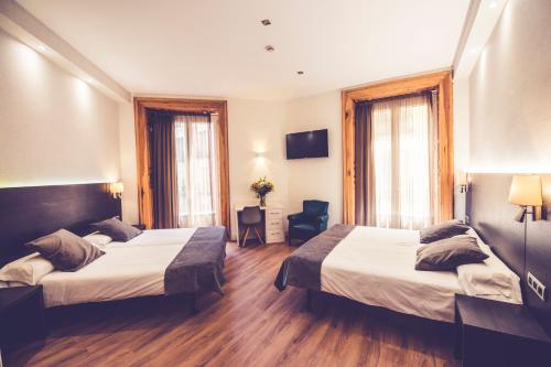 Postel nebo postele na pokoji v ubytování Hostal Marlasca