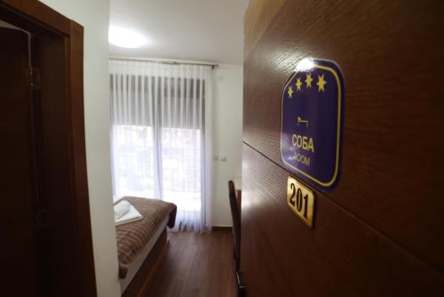 Postel nebo postele na pokoji v ubytování "Mini Hotel Vienna" Apartments