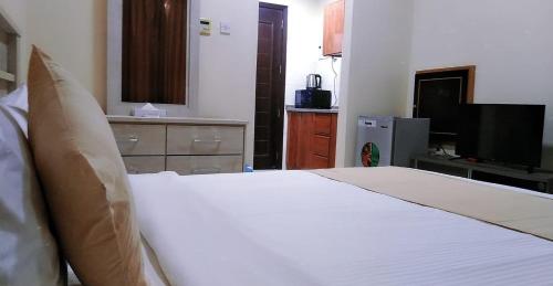 Al Khaleej Plaza Furnished Hotel Apartmentsにあるベッド