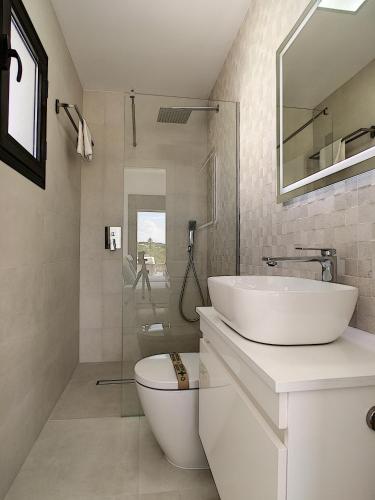 a white bathroom with a sink and a toilet at Villa sol - Sucina - 3909 in Sucina