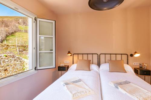 A bed or beds in a room at Terra Ecoturismo Casa La Casona
