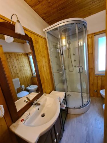 a bathroom with a shower and a sink at Baita Carla in Brunate