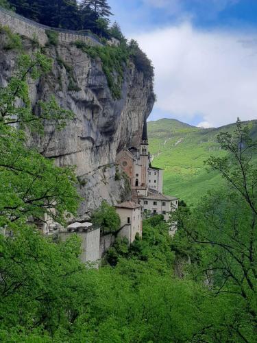 a building on the side of a mountain at APPARTAMENTO AL FORTE in Rivoli Veronese