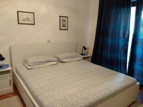 A bed or beds in a room at Apartment Nebo