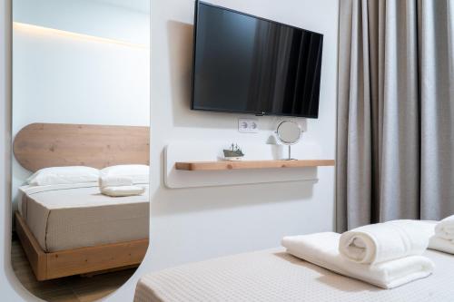 Ένα ή περισσότερα κρεβάτια σε δωμάτιο στο Oikies Doreta