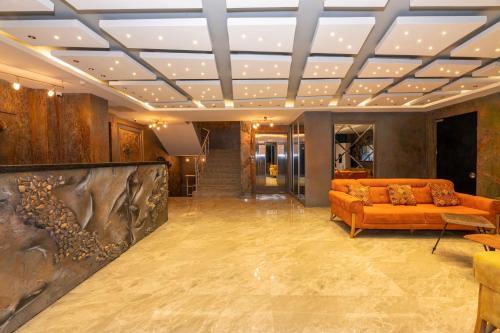 a living room with a couch in the middle at White Palace Hotel in Istanbul
