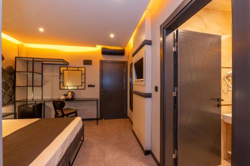 a hotel room with a bed and a desk at White Palace Hotel in Istanbul