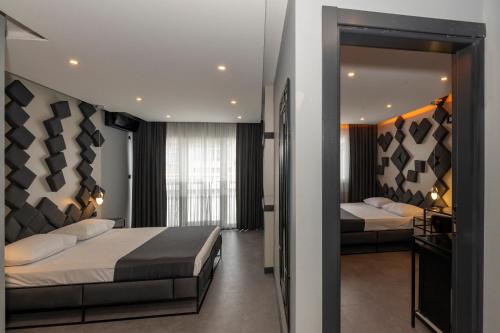 Postel nebo postele na pokoji v ubytování White Palace Hotel