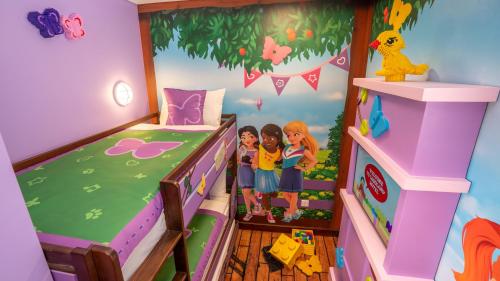 two girls standing in a doll house bedroom at LEGOLAND Hotel Dubai in Dubai