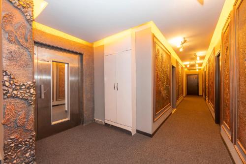 a corridor in a building with paintings on the walls at White Palace Hotel in Istanbul