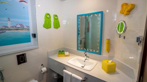 a bathroom with a sink and a mirror at LEGOLAND Hotel Dubai in Dubai