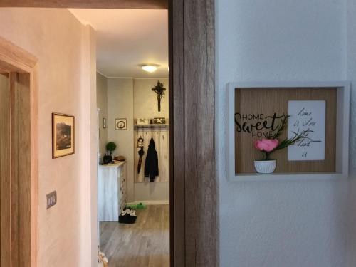 a hallway with a picture of a flower on the wall at Apartment Sara in Umag