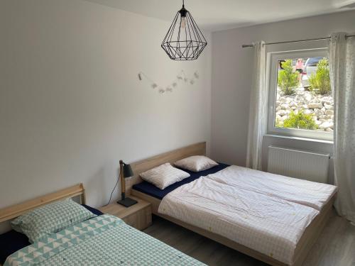 Tempat tidur dalam kamar di Apartament Maja na Spokojnej