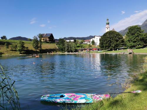 a boat sitting in the middle of a lake at Stocker´s Wohlfühlapartments in Reith im Alpbachtal