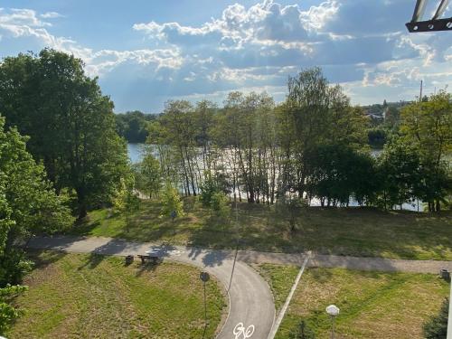 an aerial view of a road next to a river at Family & Business Sauna Apartments Klonowa nad Zalewem, Unikat SPA - 2 Bedroom with Private Sauna, Jacuzzi, Air Conditioning, Garage - The Highest Standard! in Kielce