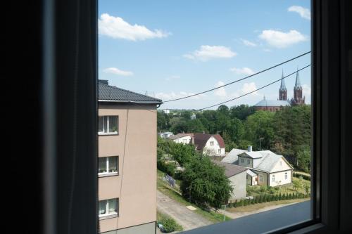 a view from a window of a building at G & M Apartamentai in Anykščiai