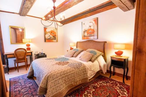 Postel nebo postele na pokoji v ubytování Hotel à l'Oriel