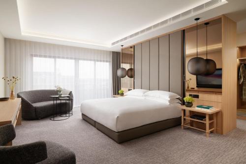 a hotel room with a bed and a living room at Nobu Hotel London Portman Square in London