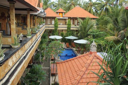 an aerial view of a house with a swimming pool at Nitya Home Stay Lembongan in Nusa Lembongan
