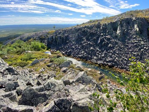 a view from the top of a rocky mountain at Arctic Lodges Lapland Ski in Studio, slopes, ski tracks, National Park, free Wi-Fi - Lapland Villas in Pyhätunturi
