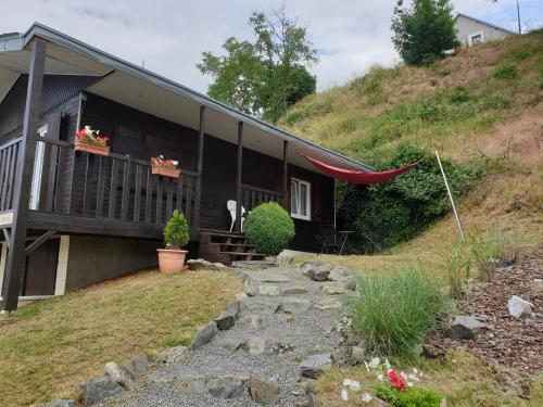 a house on the side of a hill at Chalet le logis des autre in Vireux-Wallerand