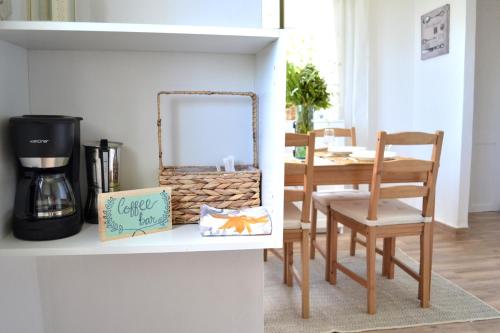 a dining room table with a mirror and a chair at Casa Nieves de Mario in Santa Cruz de la Palma