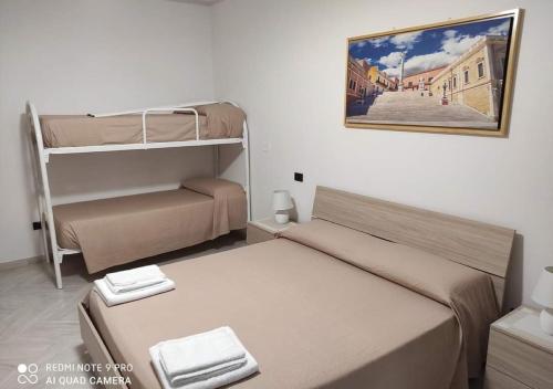 Posteľ alebo postele v izbe v ubytovaní B&B Annunziata