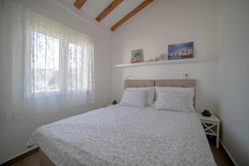 Postel nebo postele na pokoji v ubytování Seascape Beach House Korcula