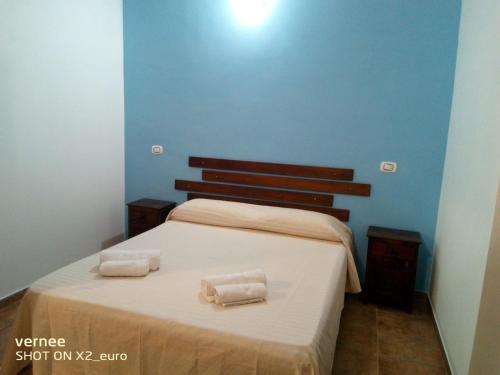 En eller flere senge i et værelse på Martina Malmostosa