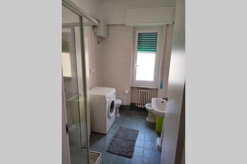 a bathroom with a shower and a toilet and a sink at Incantevole appartamento sul mare - Borgo Marina in Imperia