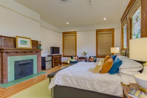 a bedroom with a bed and a fireplace at Oak Hall Bed and Breakfast in Vicksburg