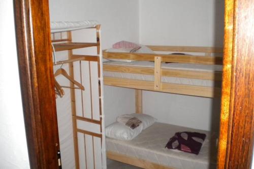 a room with three bunk beds in a room at Villa sul mare panorama unico in Nebida