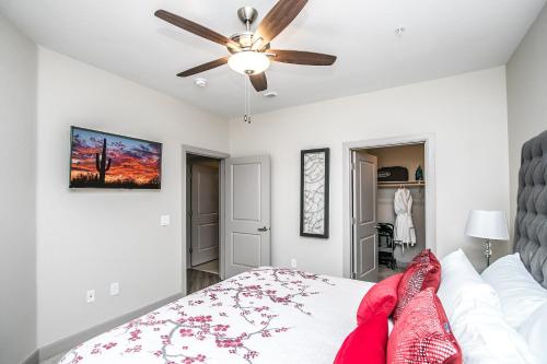 a bedroom with a bed and a ceiling fan at Rooftop Pool - TPC, Shopping & Dining 2 Miles wtih Parking - 4419 in Scottsdale