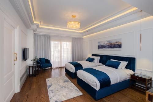 Ένα ή περισσότερα κρεβάτια σε δωμάτιο στο Maran Residence