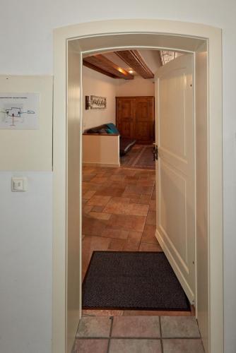 a hallway with a door open to a room at Ferienwohnung in Rheinfelder Altstadt in Rheinfelden