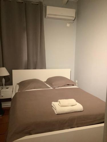 Postel nebo postele na pokoji v ubytování VILLA ALIZEE APPARTEMENT 2