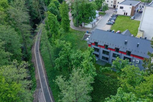 an aerial view of a house and a road at Tip Tap Guest House in Druskininkai