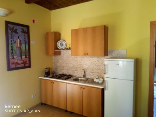 A kitchen or kitchenette at Le Terrazze di Martina