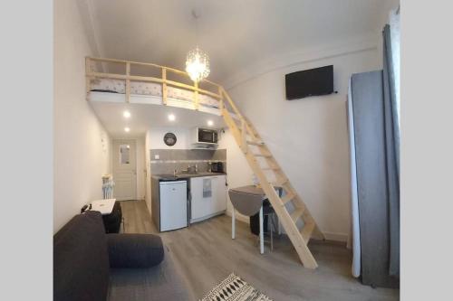 a living room with a loft bed and a kitchen at Superbe studio sur Nice in Nice